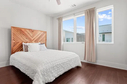 a bedroom with a bed and window