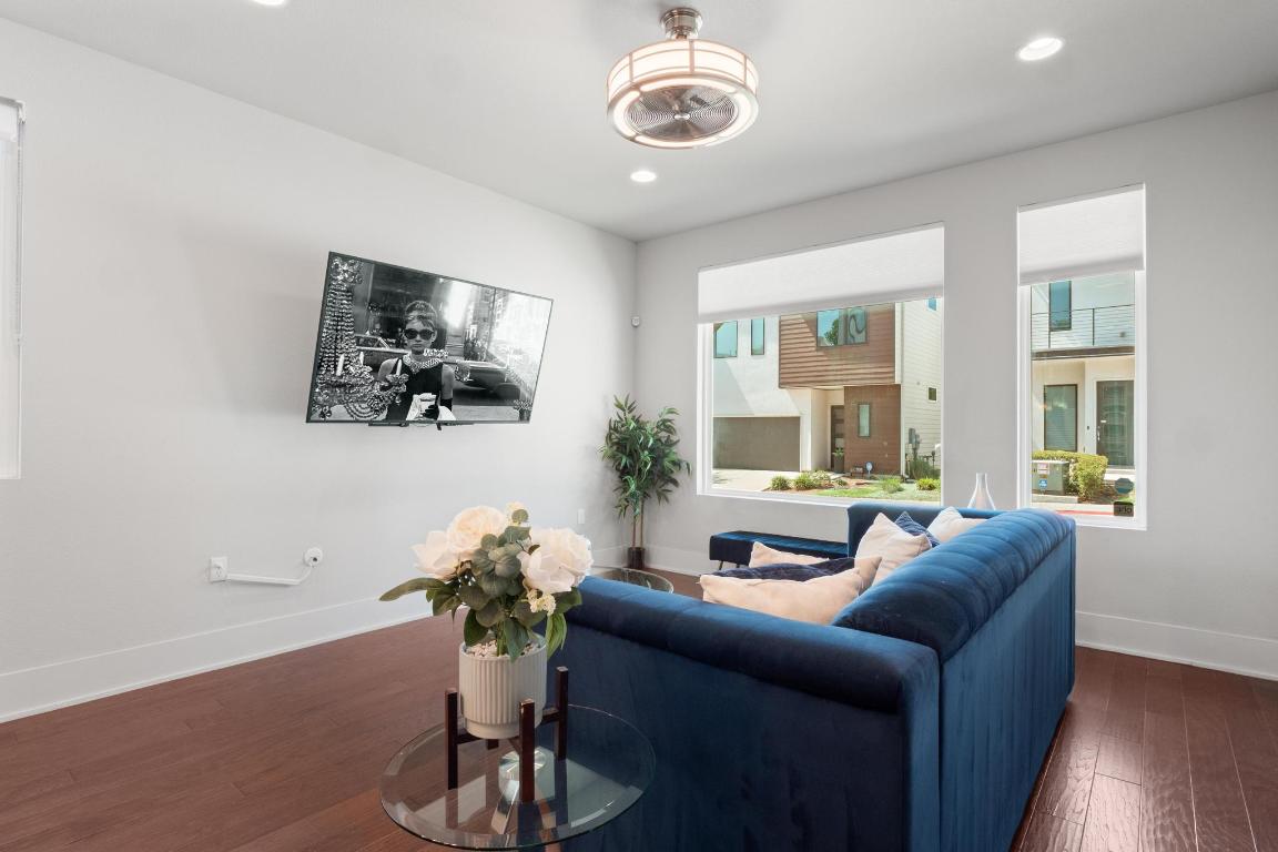 7924 Yellow Thistle Trail, Unit 39 Austin, TX 78735 - Photo 5 of 26 a living room with furniture and a large window