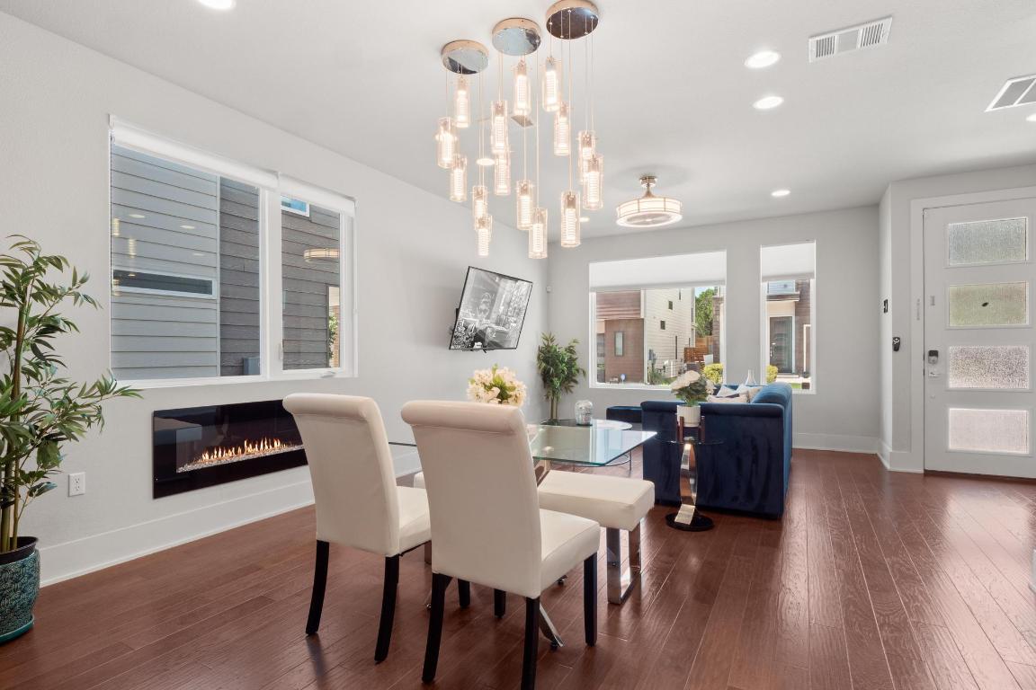 7924 Yellow Thistle Trail, Unit 39 Austin, TX 78735 - Photo 7 of 26 a view of a dining room with furniture and wooden floor