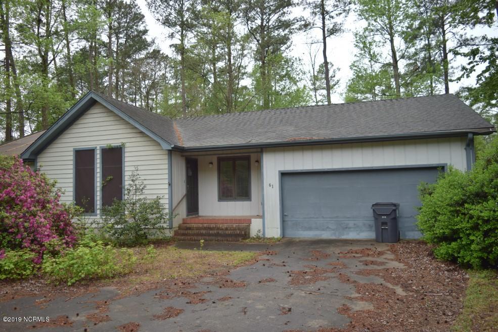 61 Persimmon Road Southwest Carolina Shores, NC 28467 - Photo 1 of 24 Front