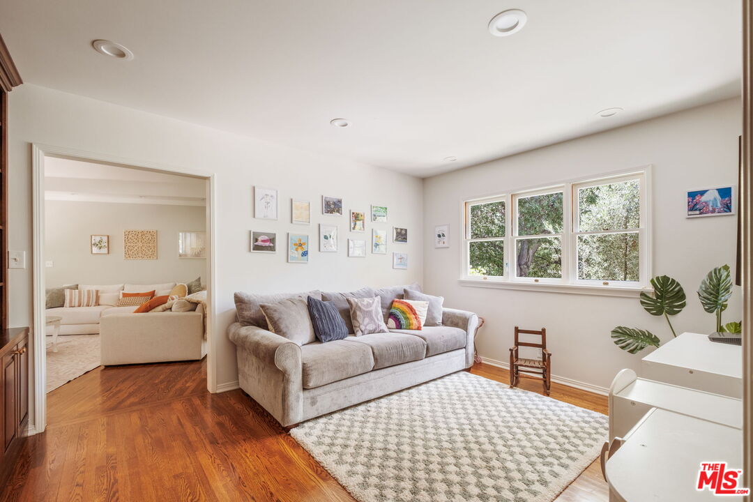 1265 Inverness Drive Pasadena, CA 91103 - Photo 14 of 56 a living room with furniture and a large window