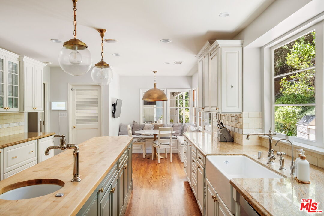 1265 Inverness Drive Pasadena, CA 91103 - Photo 22 of 56 a very nice looking kitchen with granite countertop a large window and a sink
