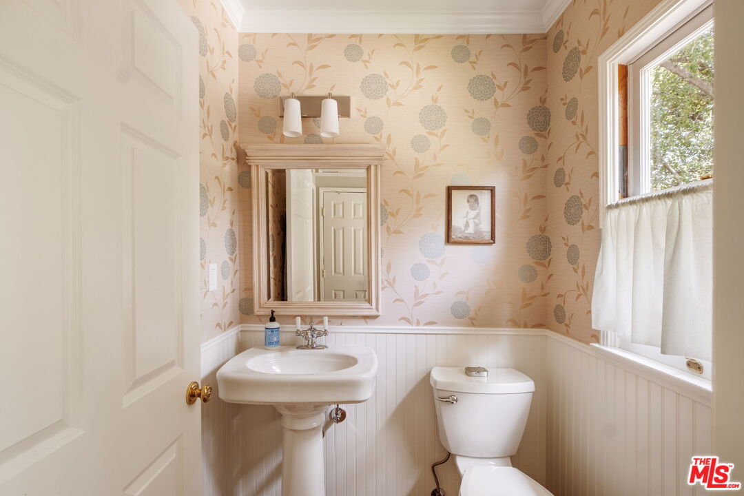 1265 Inverness Drive Pasadena, CA 91103 - Photo 28 of 56 a bathroom with a sink and mirror with toilet