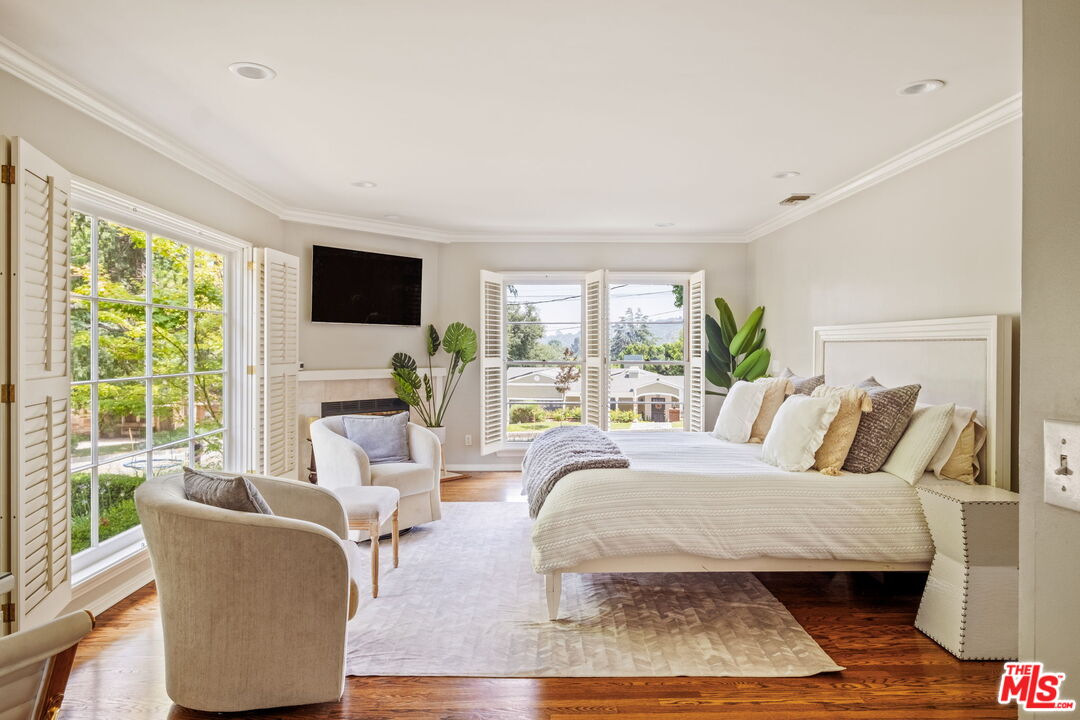 1265 Inverness Drive Pasadena, CA 91103 - Photo 29 of 56 a living room with furniture large window and a flat screen tv