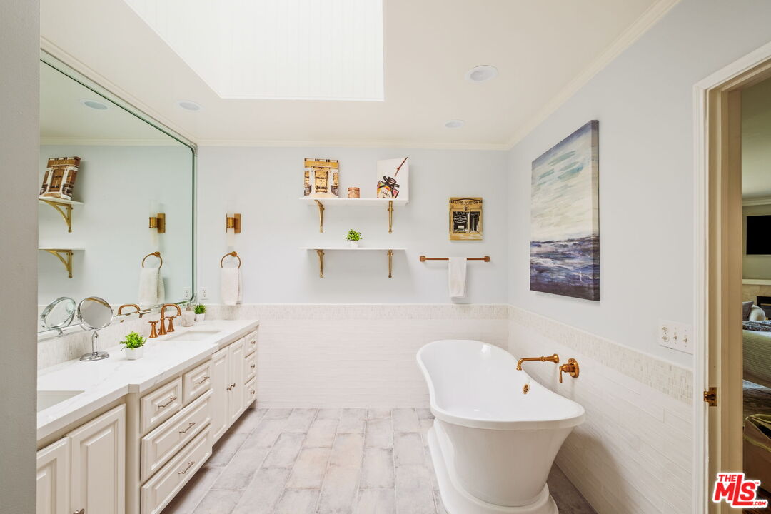 1265 Inverness Drive Pasadena, CA 91103 - Photo 34 of 56 a bathroom with a sink a toilet and a bathtub