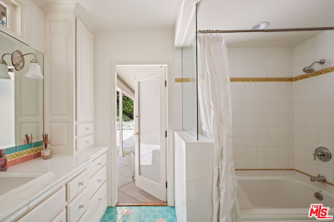 1265 Inverness Drive Pasadena, CA 91103 - Photo 43 of 56 a bathroom with a shower and a sink