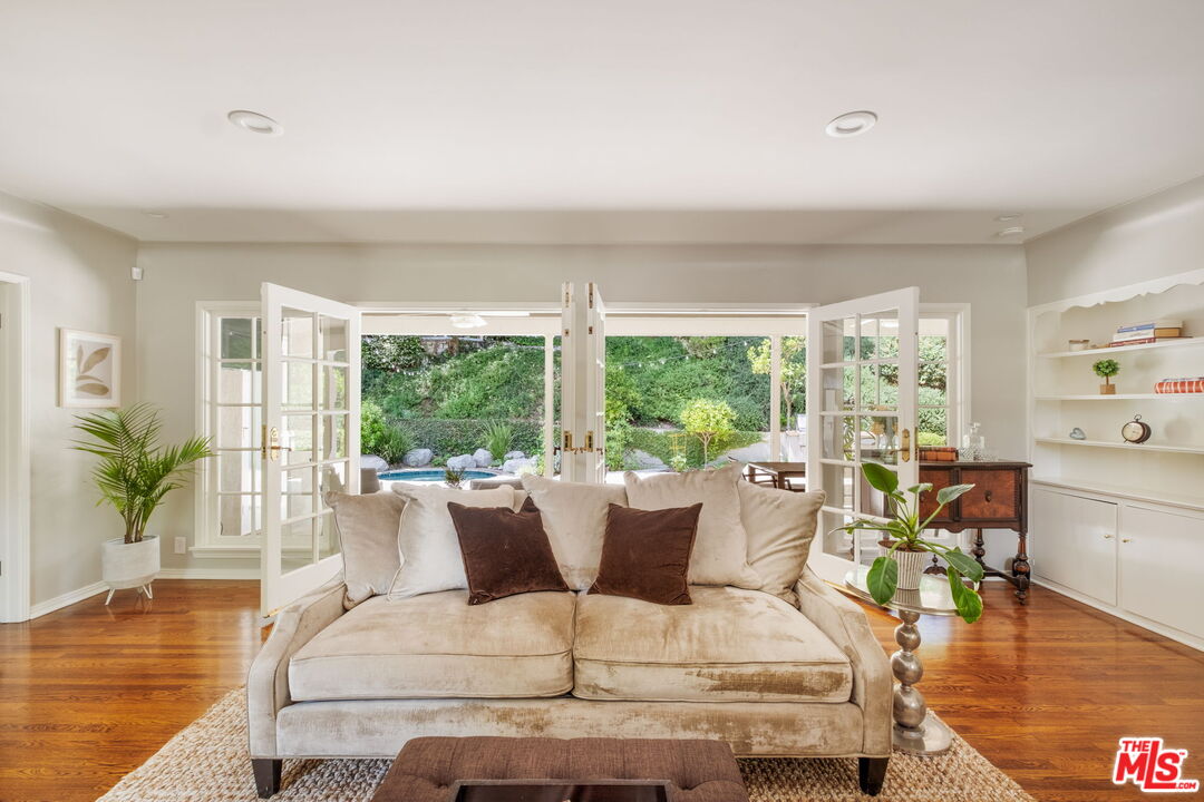 1265 Inverness Drive Pasadena, CA 91103 - Photo 7 of 56 a living room with furniture and a large window
