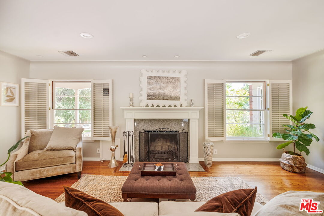 1265 Inverness Drive Pasadena, CA 91103 - Photo 9 of 56 a living room with furniture and a fireplace