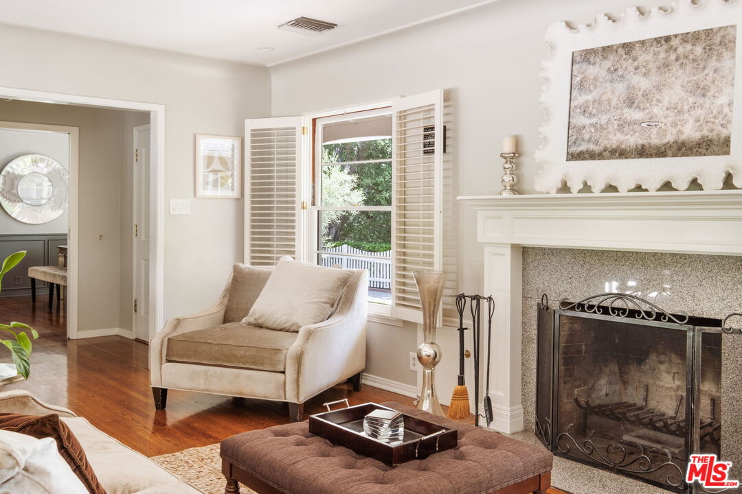 1265 Inverness Drive Pasadena, CA 91103 - Photo 10 of 56 a living room with furniture and a fireplace