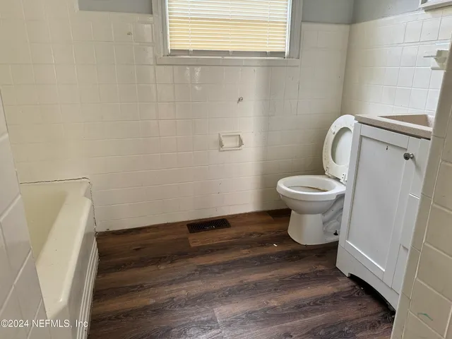 a bathroom with a toilet and a sink