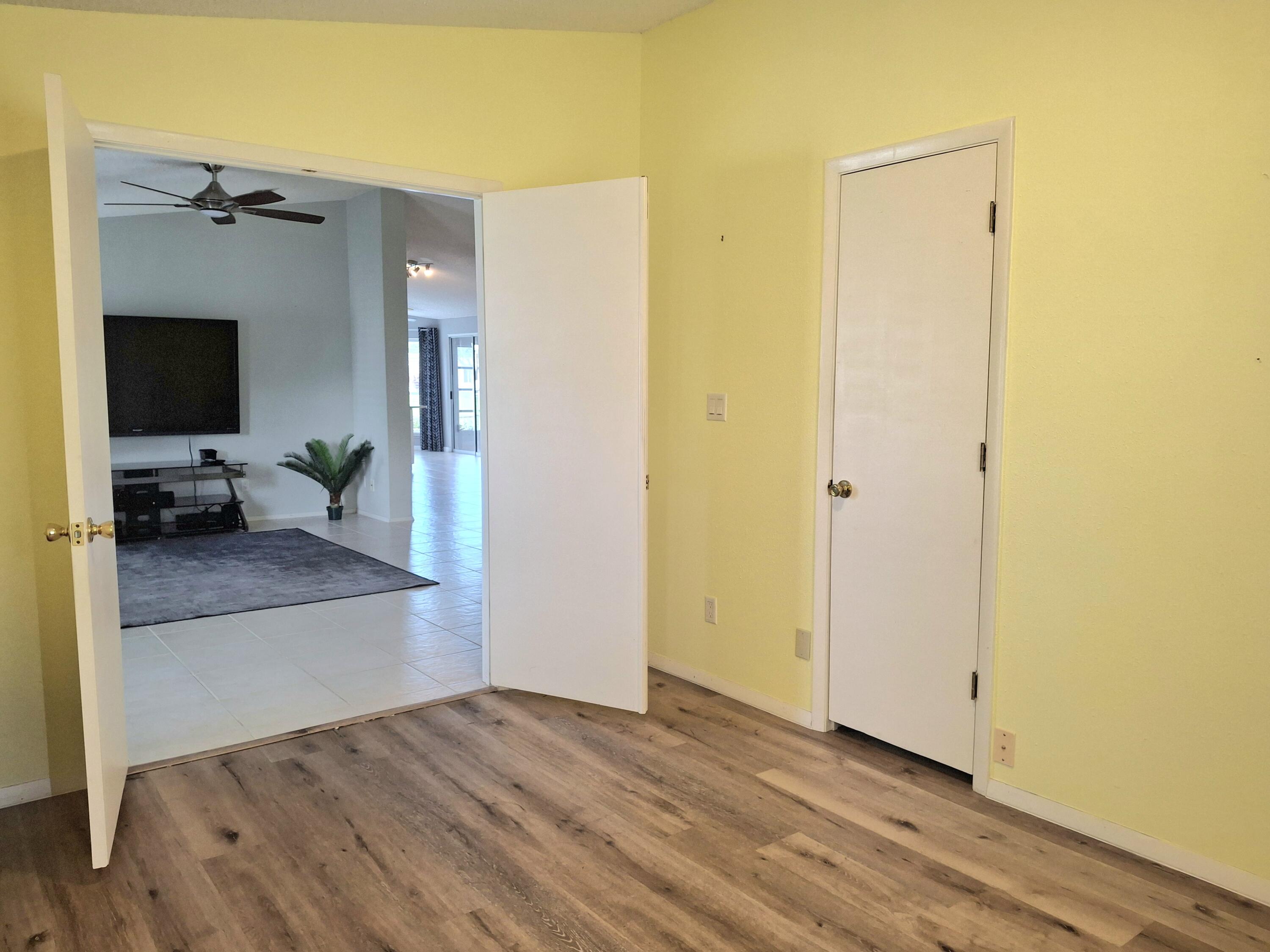 8483 Schefflera Court Port St. Lucie, FL 34952 - Photo 20 of 33 a view of a living room with a wooden floor