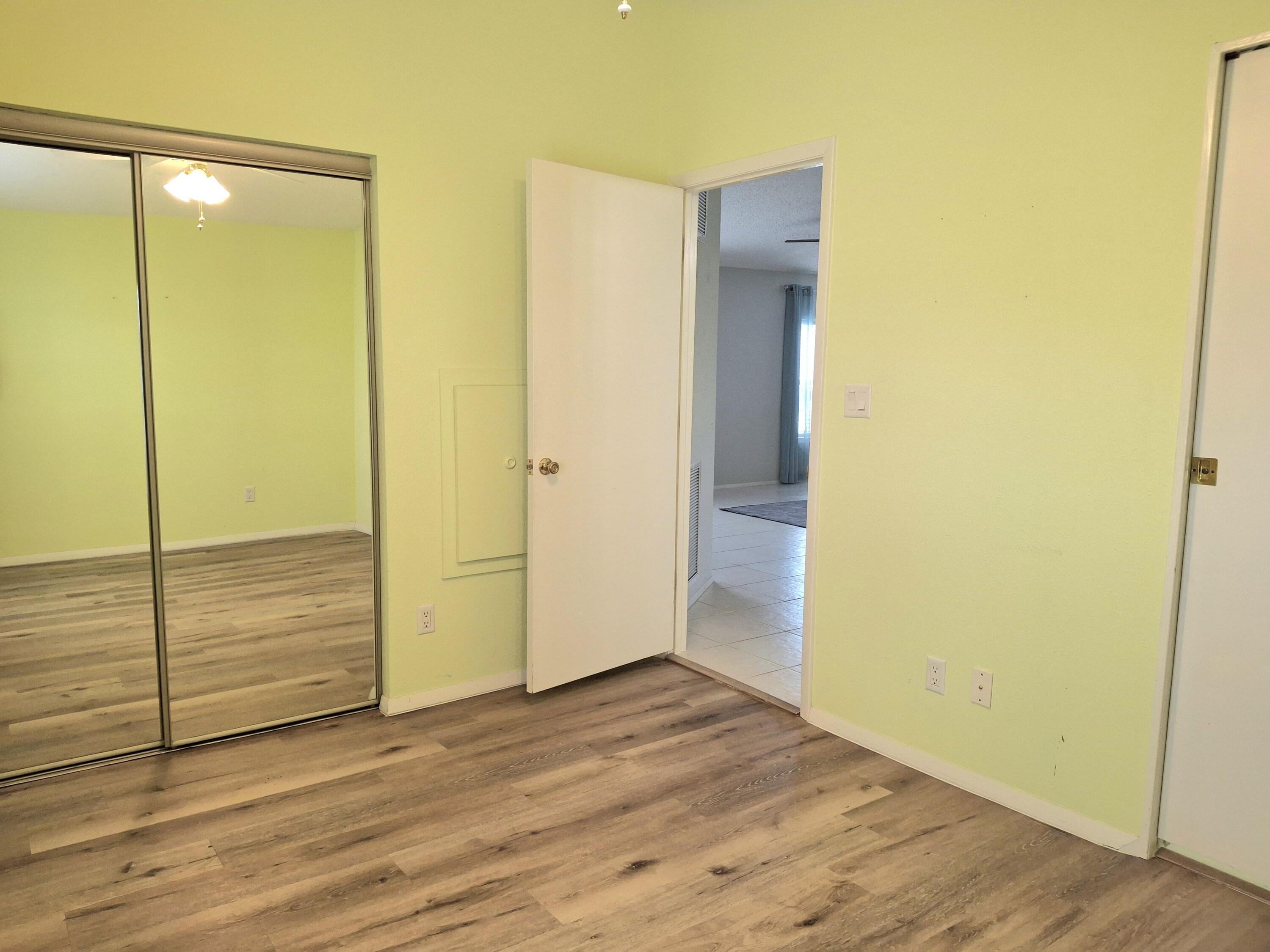 8483 Schefflera Court Port St. Lucie, FL 34952 - Photo 21 of 33 a view of front door and wooden floor