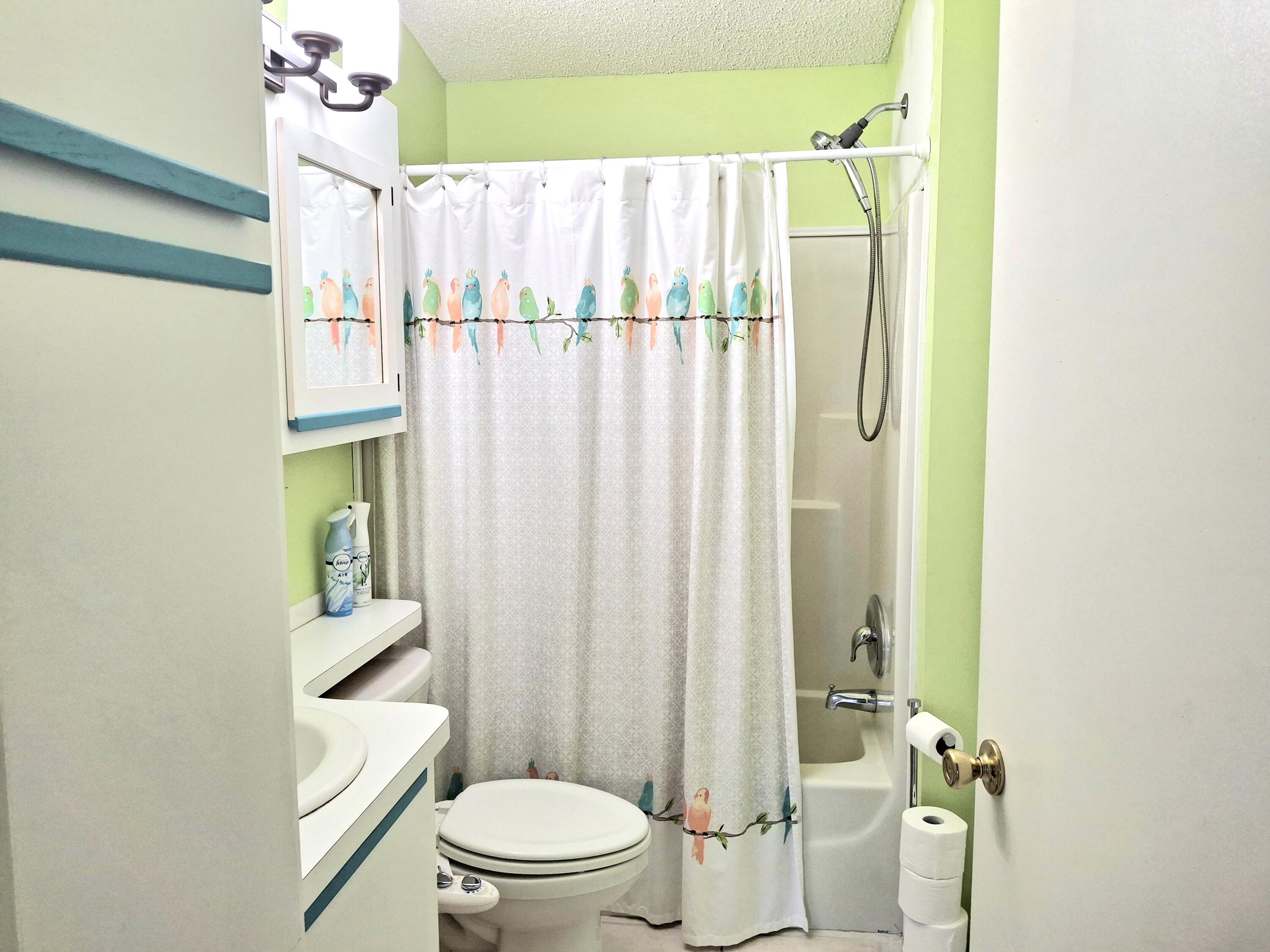 8483 Schefflera Court Port St. Lucie, FL 34952 - Photo 26 of 33 a white toilet sitting next to a bathroom sink