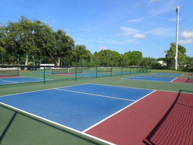 8483 Schefflera Court Port St. Lucie, FL 34952 - Photo 30 of 33 a view of an outdoor space and tennis court