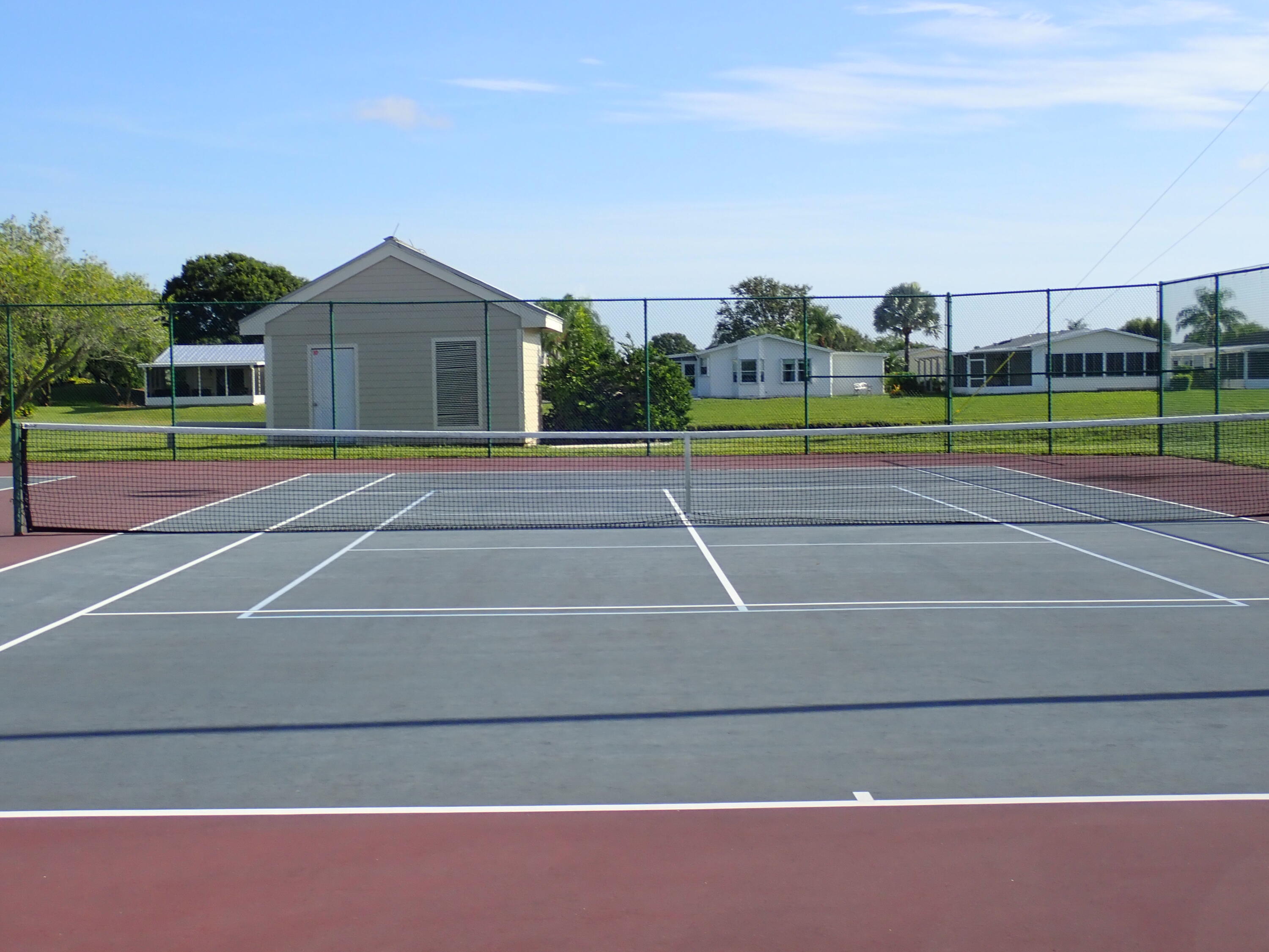 8483 Schefflera Court Port St. Lucie, FL 34952 - Photo 33 of 33 a view of a tennis court