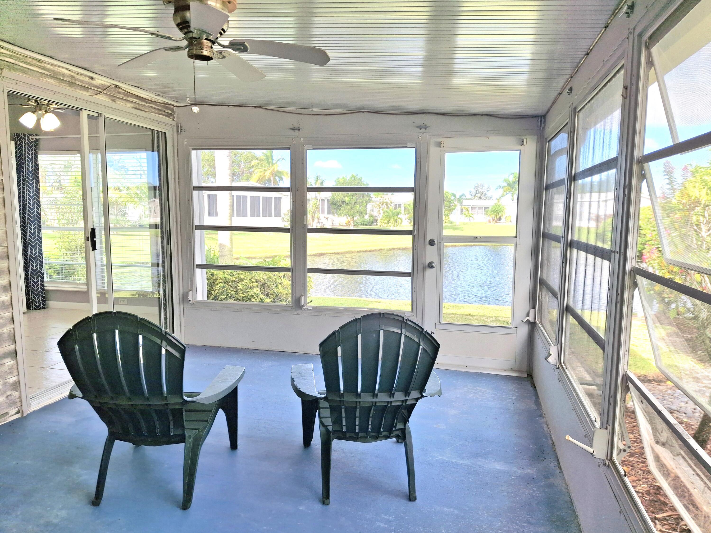 8483 Schefflera Court Port St. Lucie, FL 34952 - Photo 8 of 33 a living room with furniture and a large window