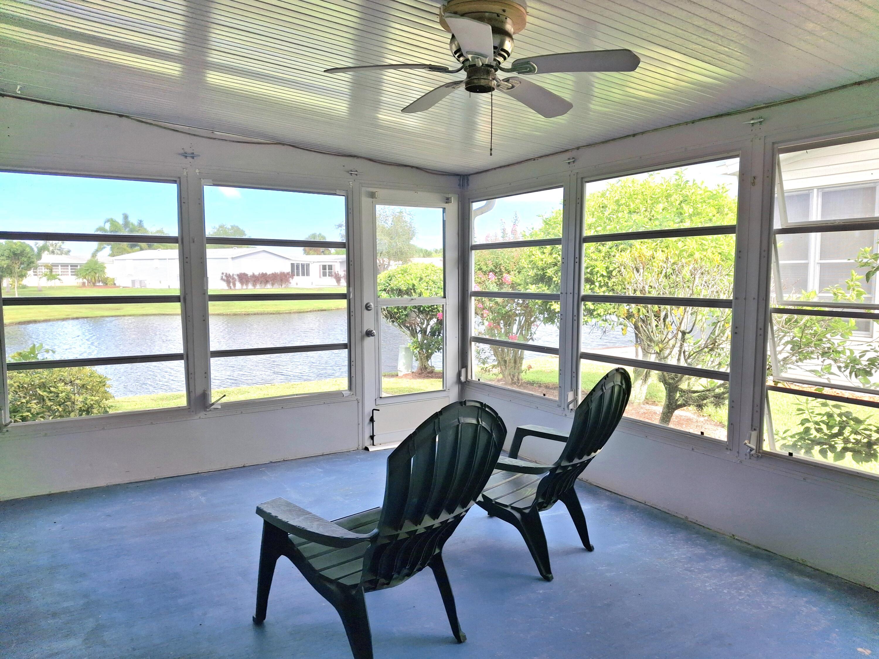 8483 Schefflera Court Port St. Lucie, FL 34952 - Photo 9 of 33 a view of a livingroom with furniture and windows
