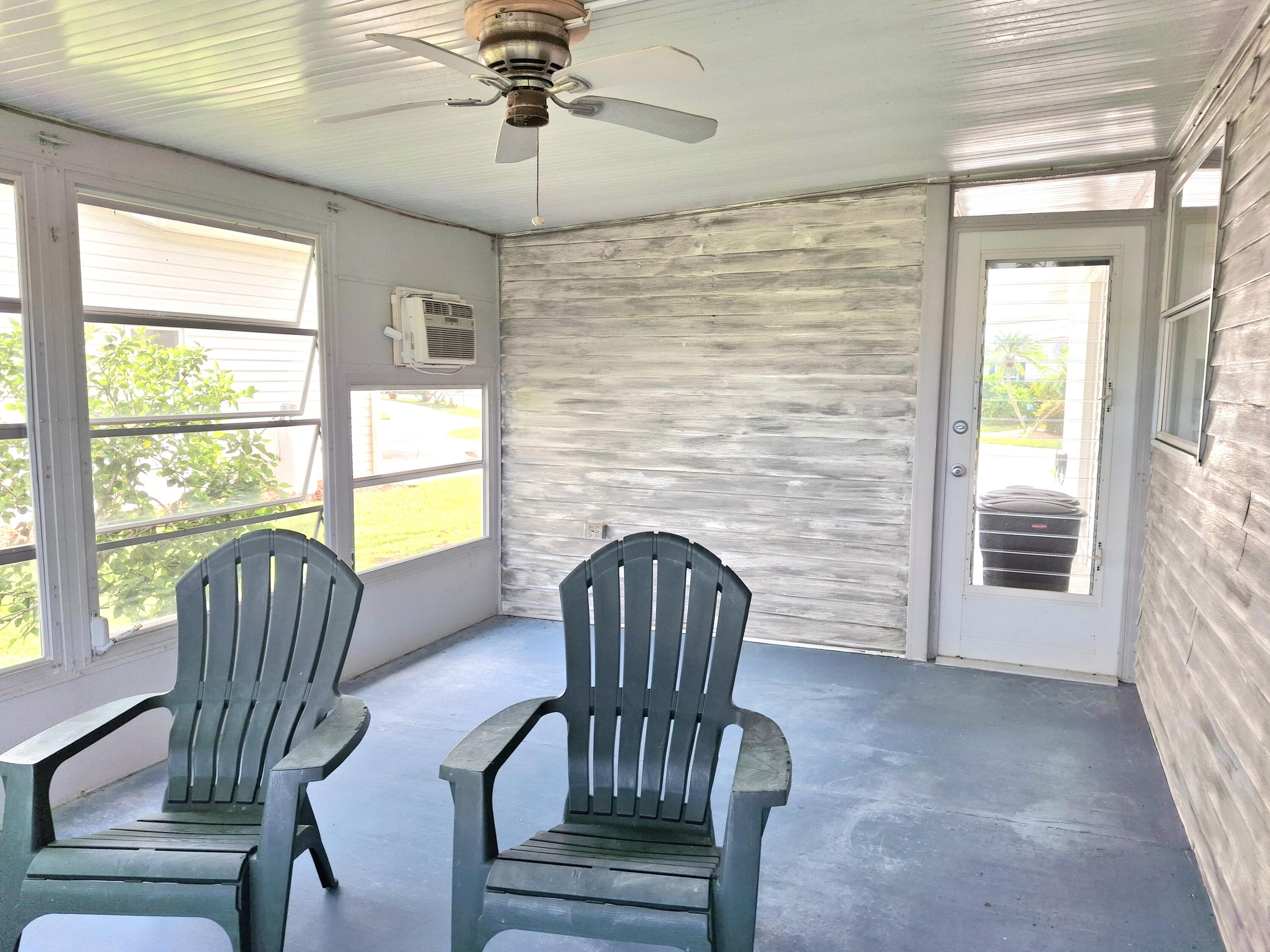 8483 Schefflera Court Port St. Lucie, FL 34952 - Photo 10 of 33 a living room with furniture and a windows
