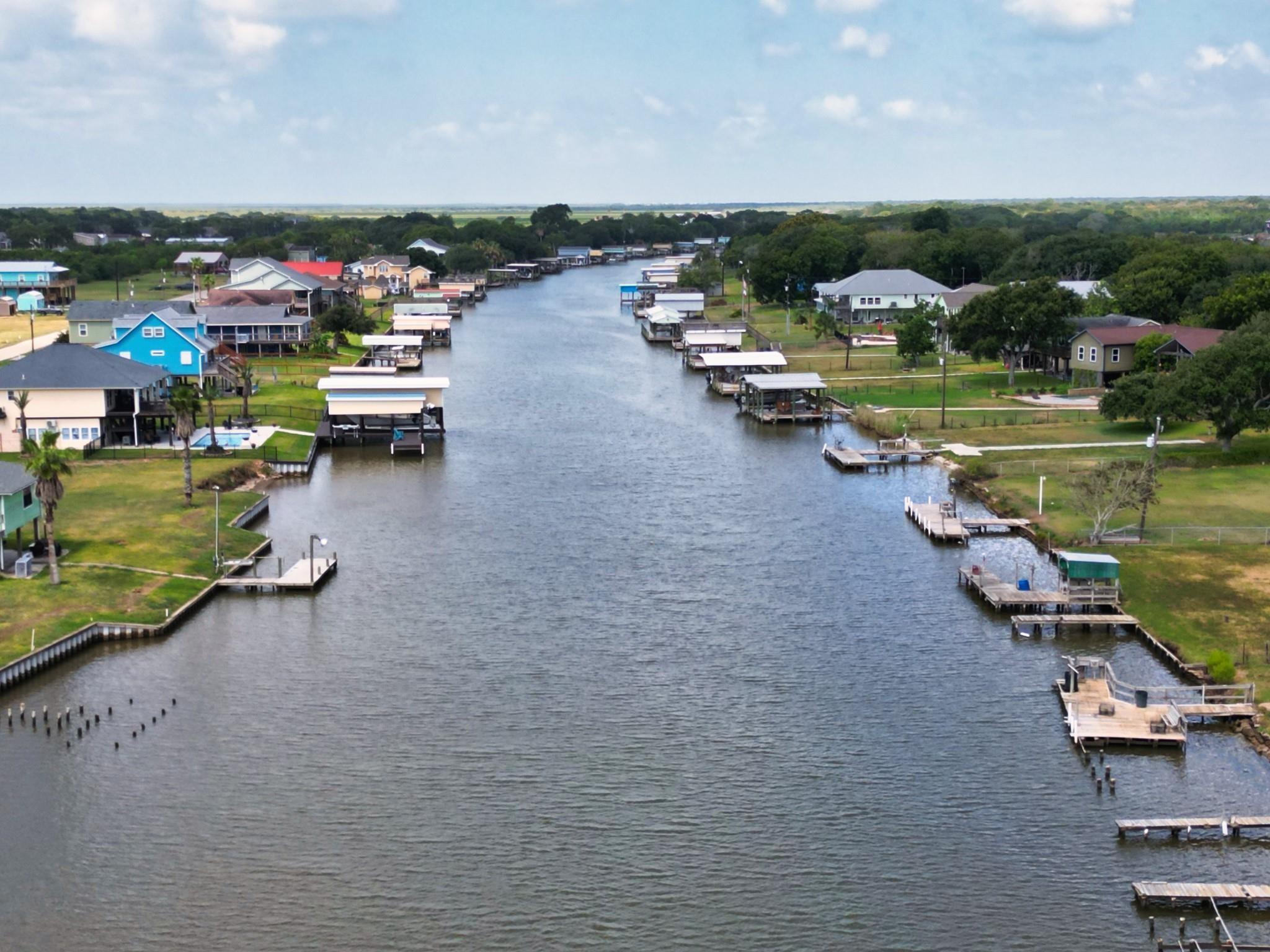 1867 County Road 291 Sargent, TX 77414 - Photo 27 of 31 an aerial view of a lake with boats and trees