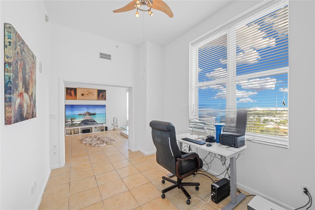 511 Southeast 5th Avenue, Unit 1906 Fort Lauderdale, FL 33301 - Photo 15 of 64 a workspace with furniture and a window
