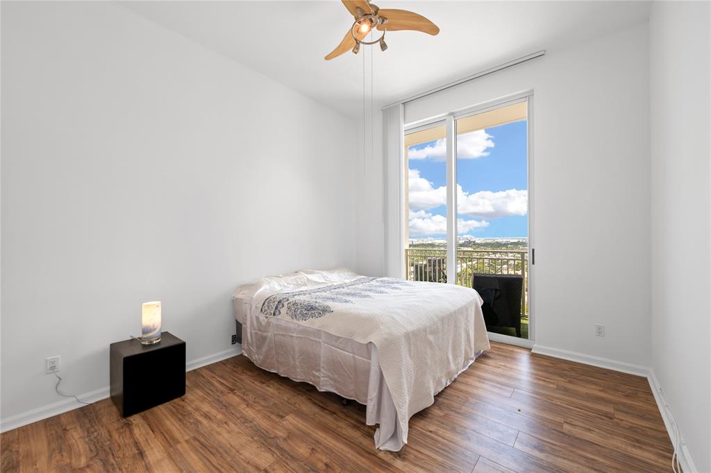 511 Southeast 5th Avenue, Unit 1906 Fort Lauderdale, FL 33301 - Photo 21 of 64 a bedroom with a bed and a large window
