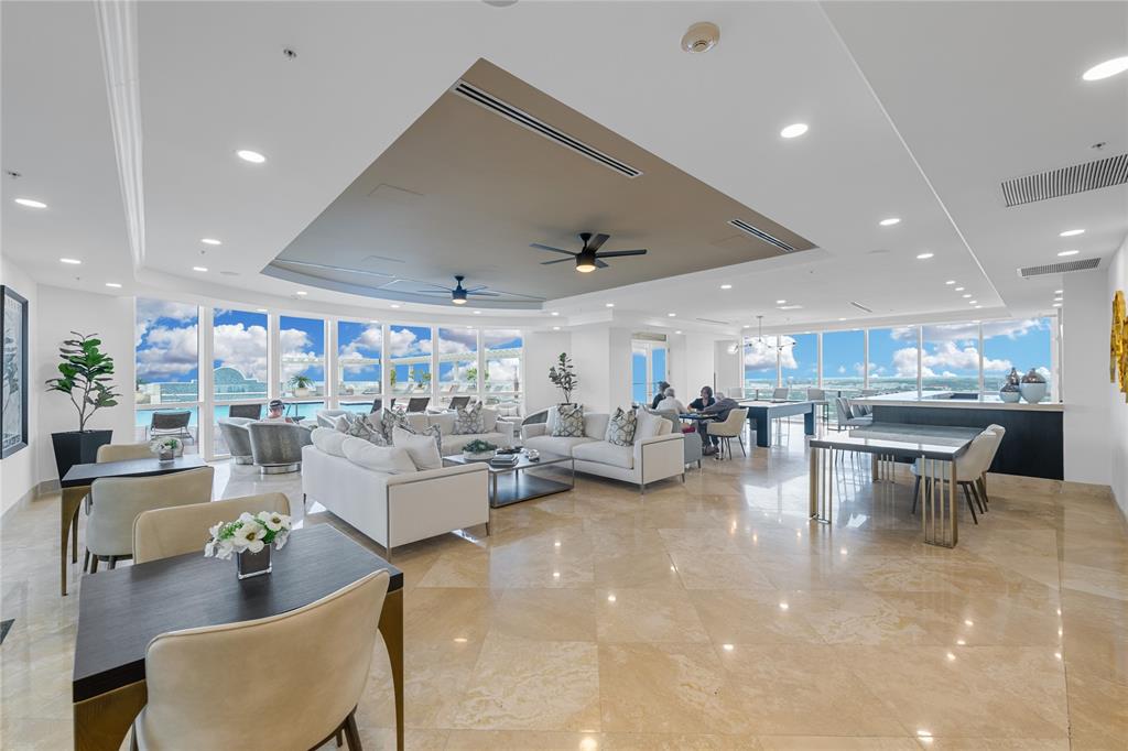 511 Southeast 5th Avenue, Unit 1906 Fort Lauderdale, FL 33301 - Photo 32 of 64 a living room with lots of furniture and a table