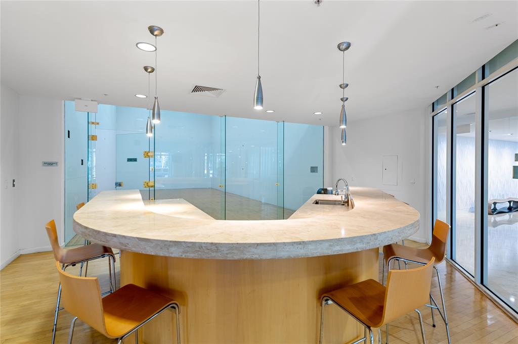 511 Southeast 5th Avenue, Unit 1906 Fort Lauderdale, FL 33301 - Photo 42 of 64 a kitchen with a table and chairs