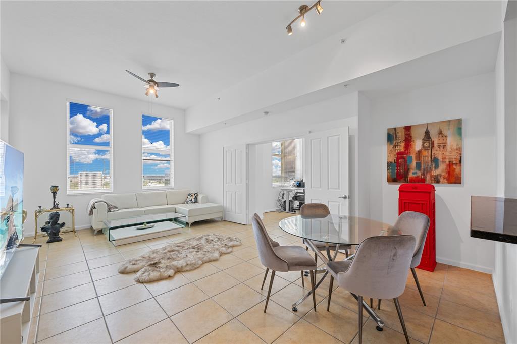 511 Southeast 5th Avenue, Unit 1906 Fort Lauderdale, FL 33301 - Photo 7 of 64 a living room with furniture and wooden floor