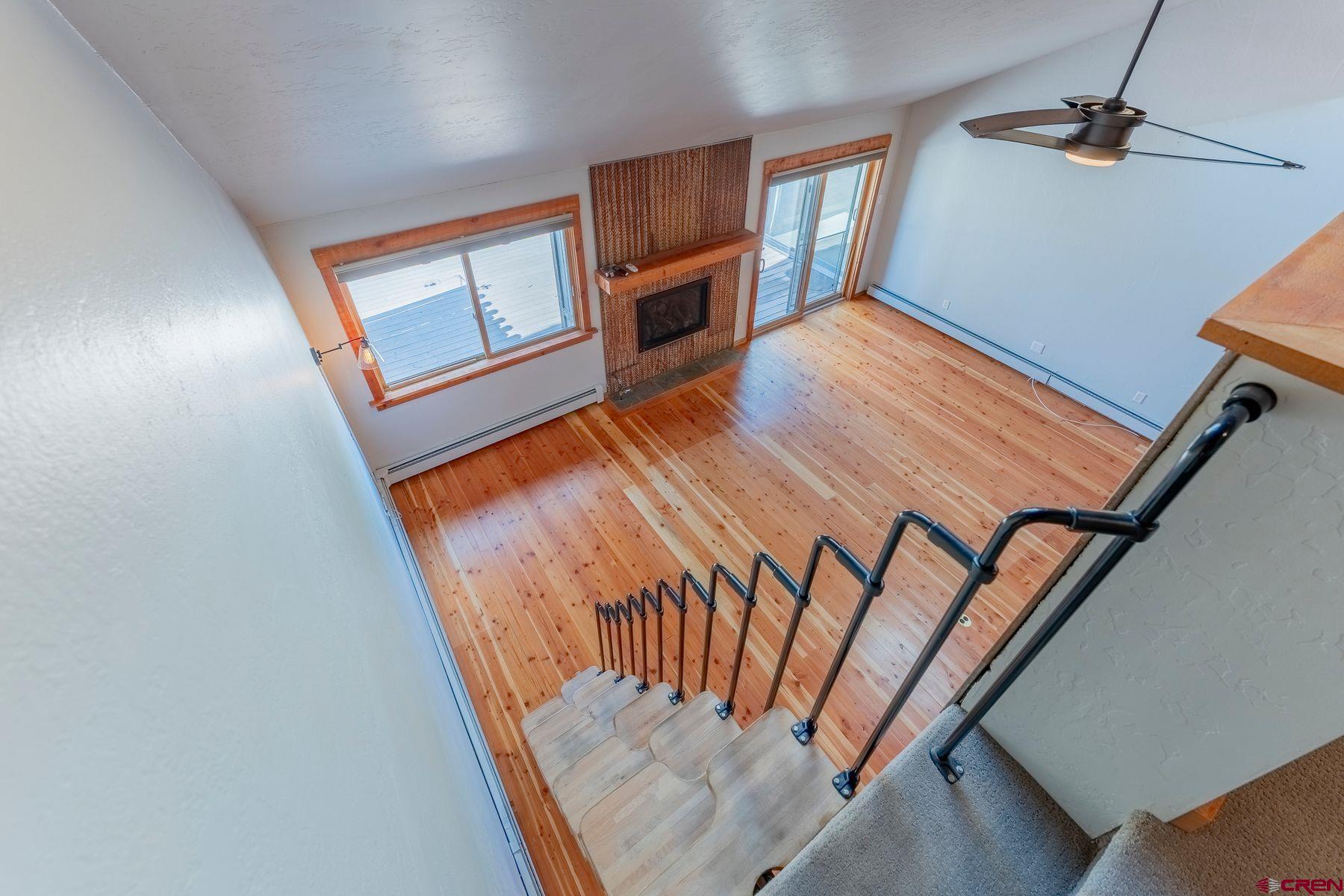 169 Camino Del Rio, Unit 8 Gunnison, CO 81230 - Photo 11 of 35 a view of an empty room and wooden floor