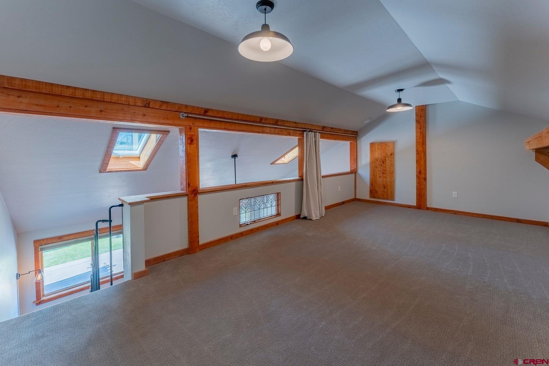 169 Camino Del Rio, Unit 8 Gunnison, CO 81230 - Photo 12 of 35 a view of an empty room with a window