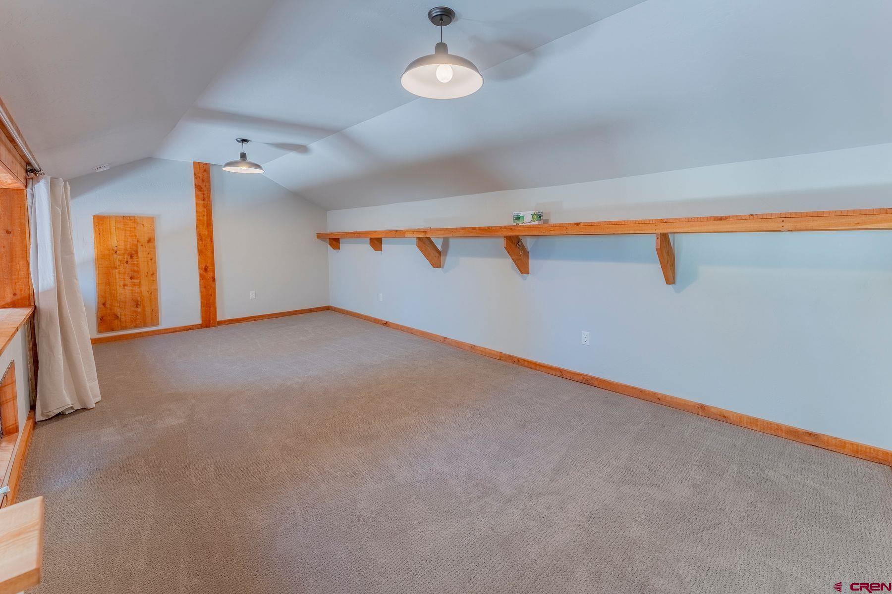 169 Camino Del Rio, Unit 8 Gunnison, CO 81230 - Photo 13 of 35 a view of an empty room with a window