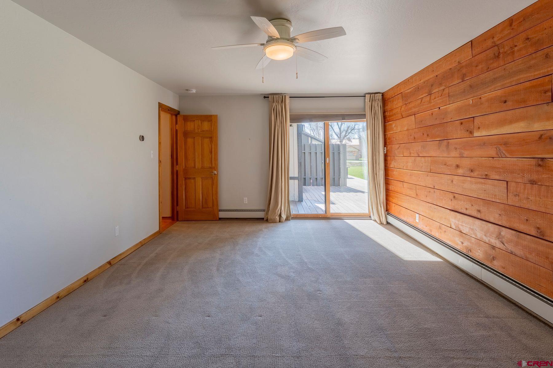 169 Camino Del Rio, Unit 8 Gunnison, CO 81230 - Photo 16 of 35 a view of empty room with ceiling fan