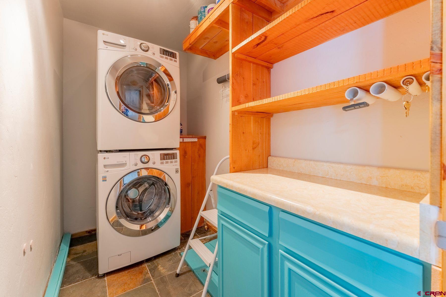 169 Camino Del Rio, Unit 8 Gunnison, CO 81230 - Photo 23 of 35 a utility room with dryer and washer