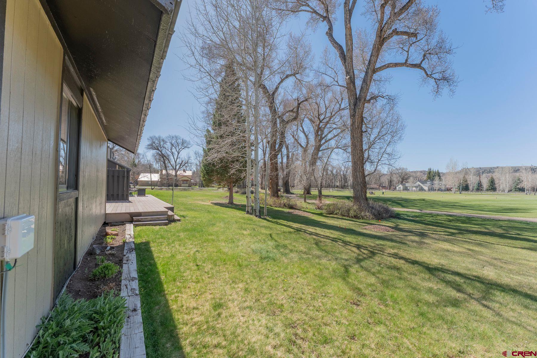 169 Camino Del Rio, Unit 8 Gunnison, CO 81230 - Photo 26 of 35 a view of a park with large trees