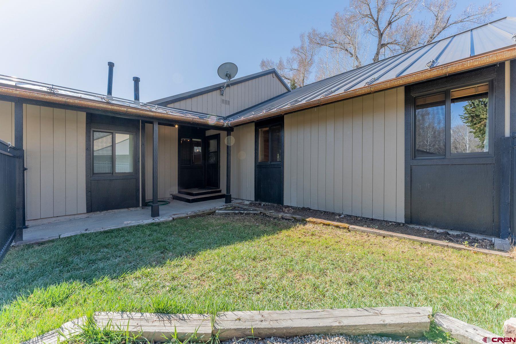 169 Camino Del Rio, Unit 8 Gunnison, CO 81230 - Photo 30 of 35 a view of backyard of the house