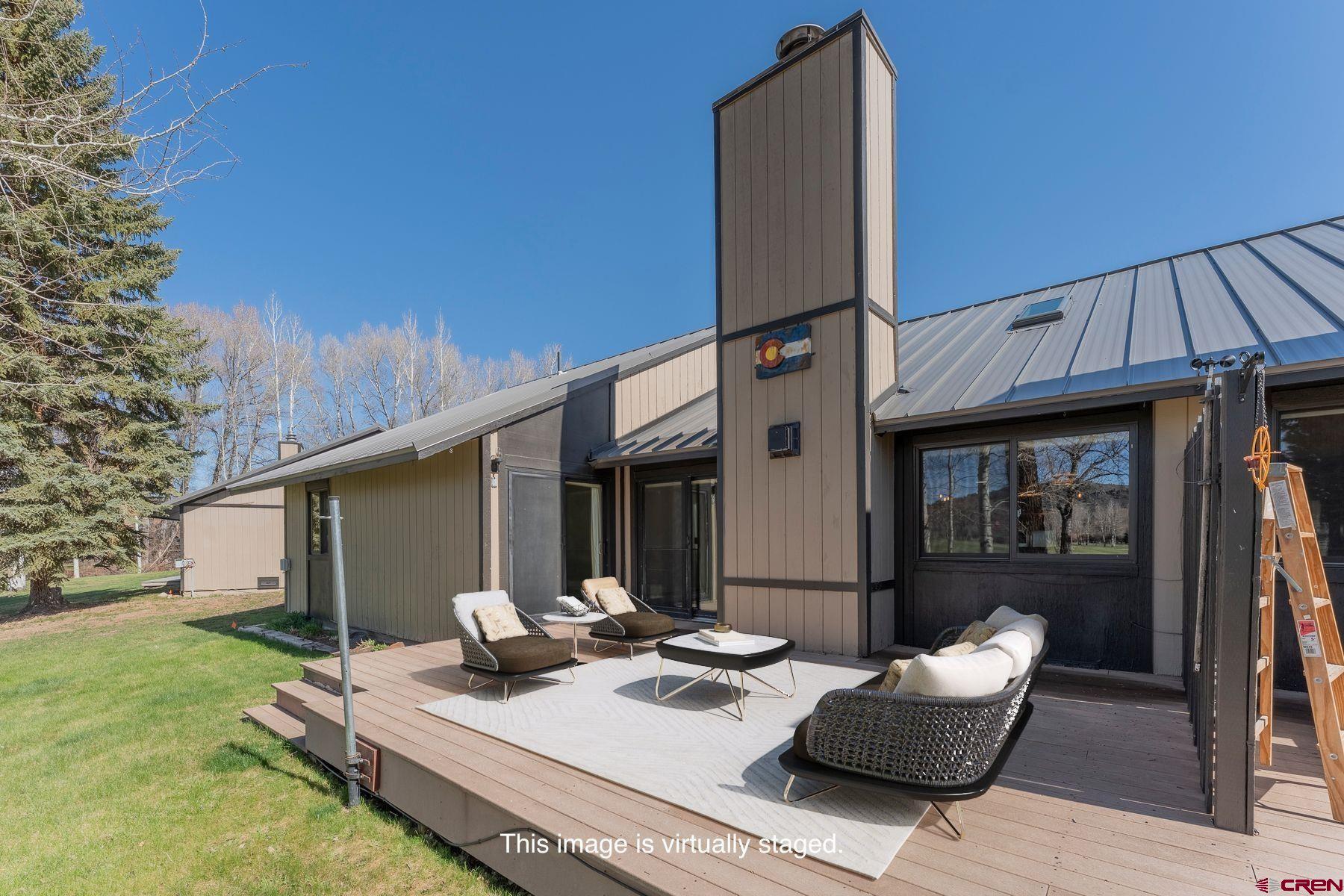 169 Camino Del Rio, Unit 8 Gunnison, CO 81230 - Photo 3 of 35 a view of backyard of the house