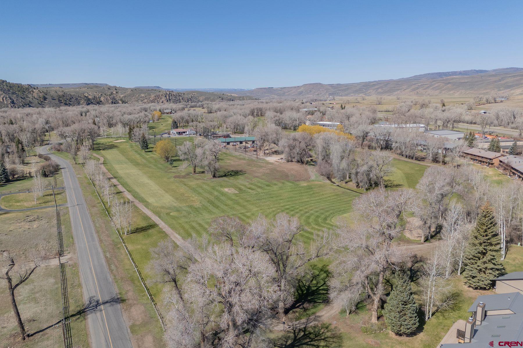 169 Camino Del Rio, Unit 8 Gunnison, CO 81230 - Photo 34 of 35 an aerial view of residential houses with outdoor space