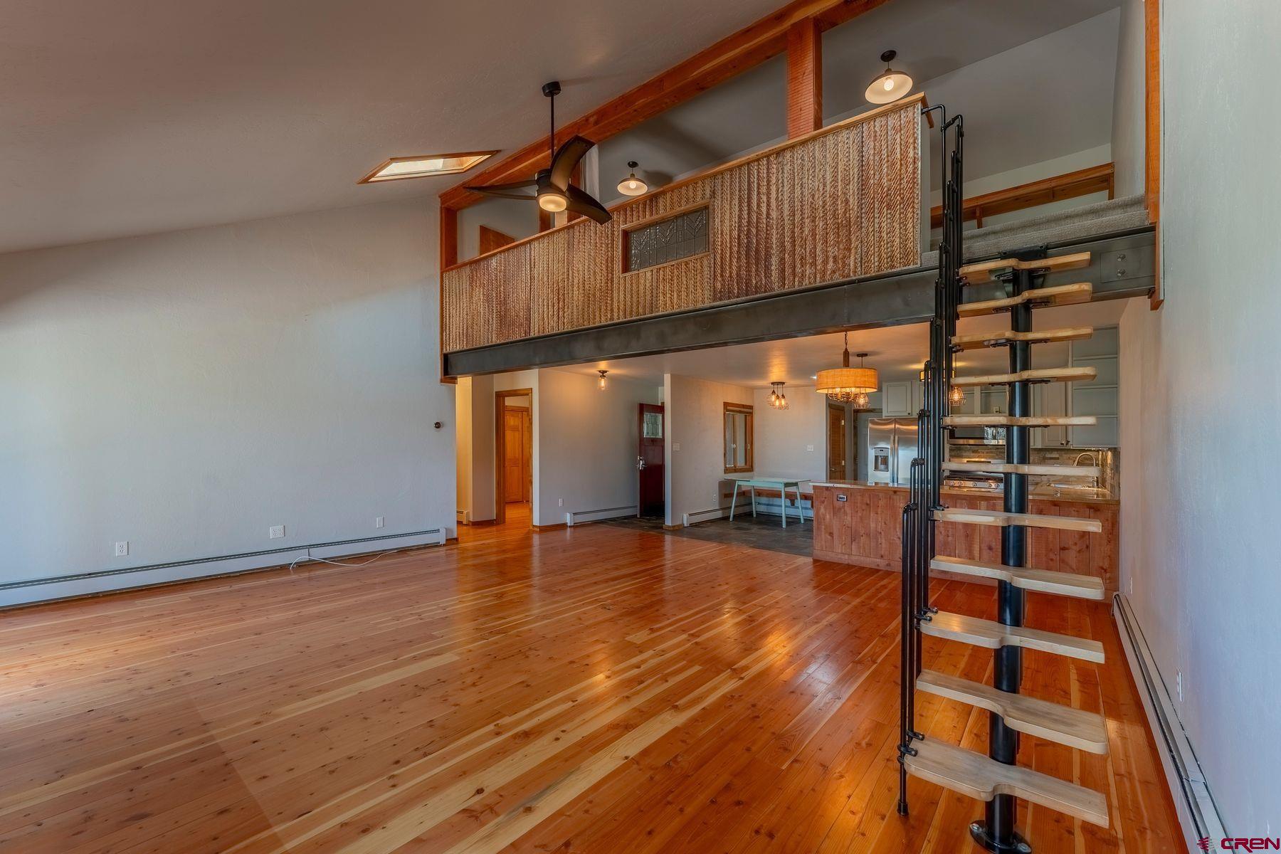 169 Camino Del Rio, Unit 8 Gunnison, CO 81230 - Photo 6 of 35 a view of a living room with a wooden floor