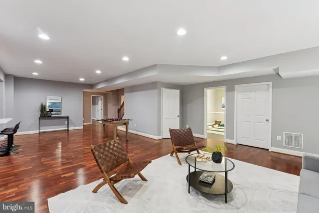 a living room with furniture pool and a table