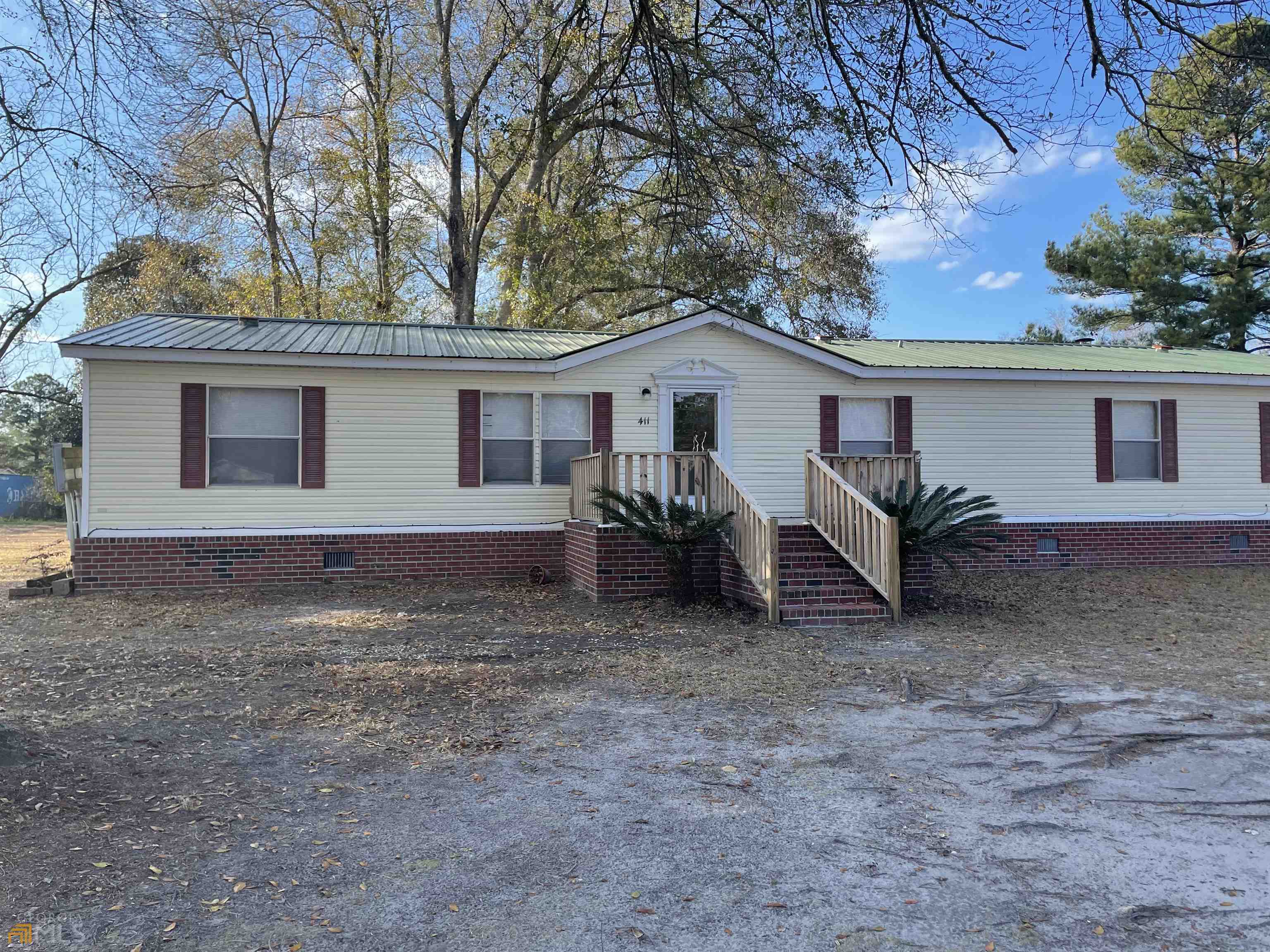 411 Hummingbird Lane Springfield, GA 31329 - Photo 1 of 1 a view of a house with a yard and large tree