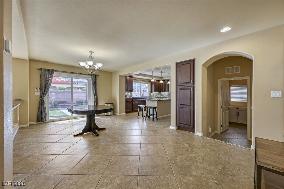 6239 Mustang Spring Avenue Las Vegas, NV 89139 - Photo 12 of 28 Dinning Room with Sliding door to Backyard and overlooking the Great Room and the Kitchen.