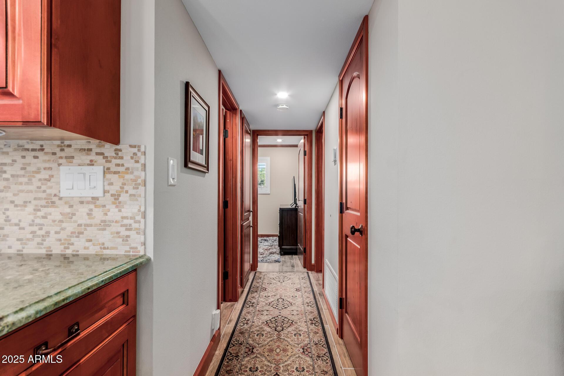 5525 East Thomas Road, Unit E3 Phoenix, AZ 85018 - Photo 13 of 31 a very nice looking hallway with a carpet