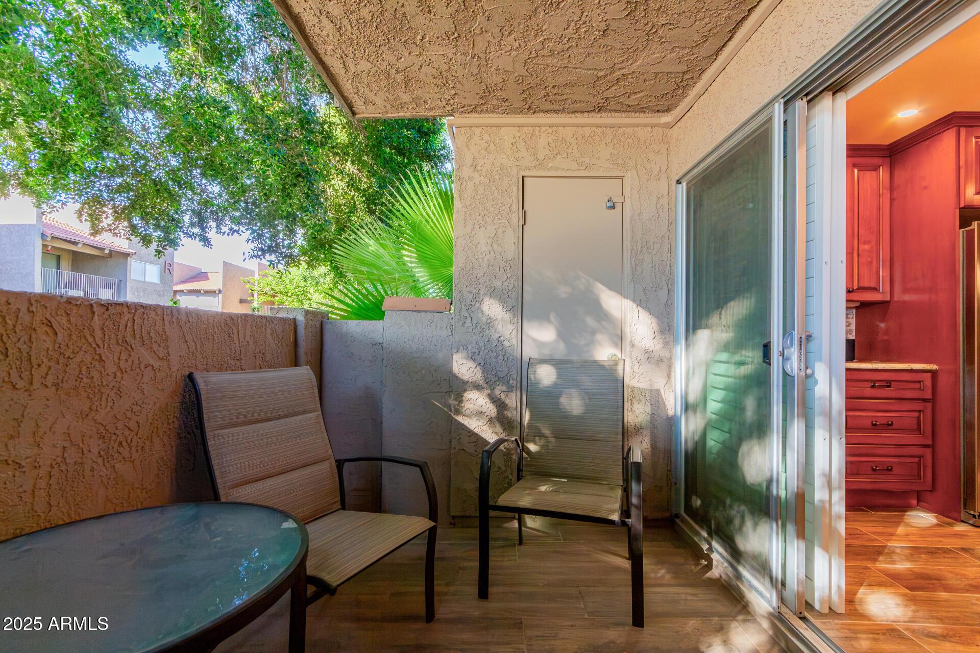 5525 East Thomas Road, Unit E3 Phoenix, AZ 85018 - Photo 25 of 31 a view of a balcony with furniture