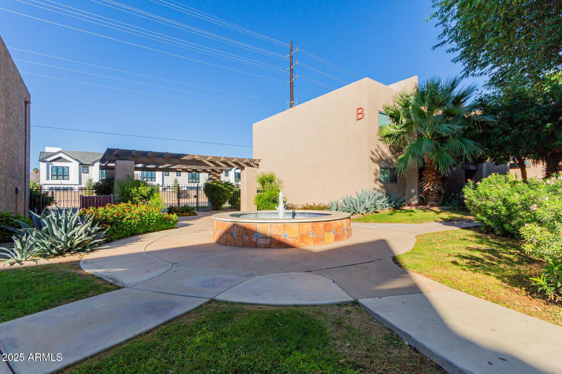 5525 East Thomas Road, Unit E3 Phoenix, AZ 85018 - Photo 26 of 31 a view of outdoor space yard and swimming pool