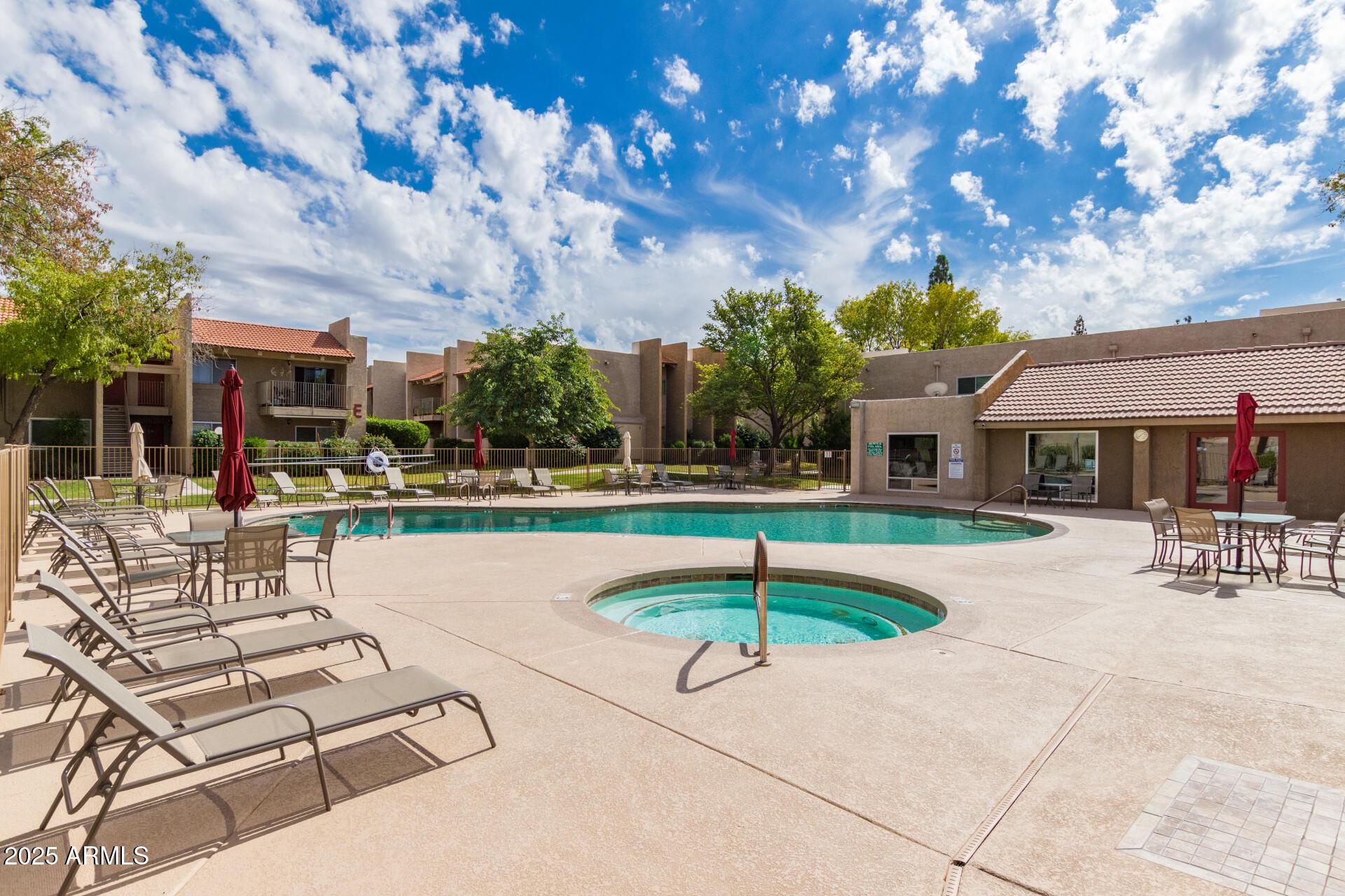 5525 East Thomas Road, Unit E3 Phoenix, AZ 85018 - Photo 30 of 31 a swimming pool with outdoor seating and yard