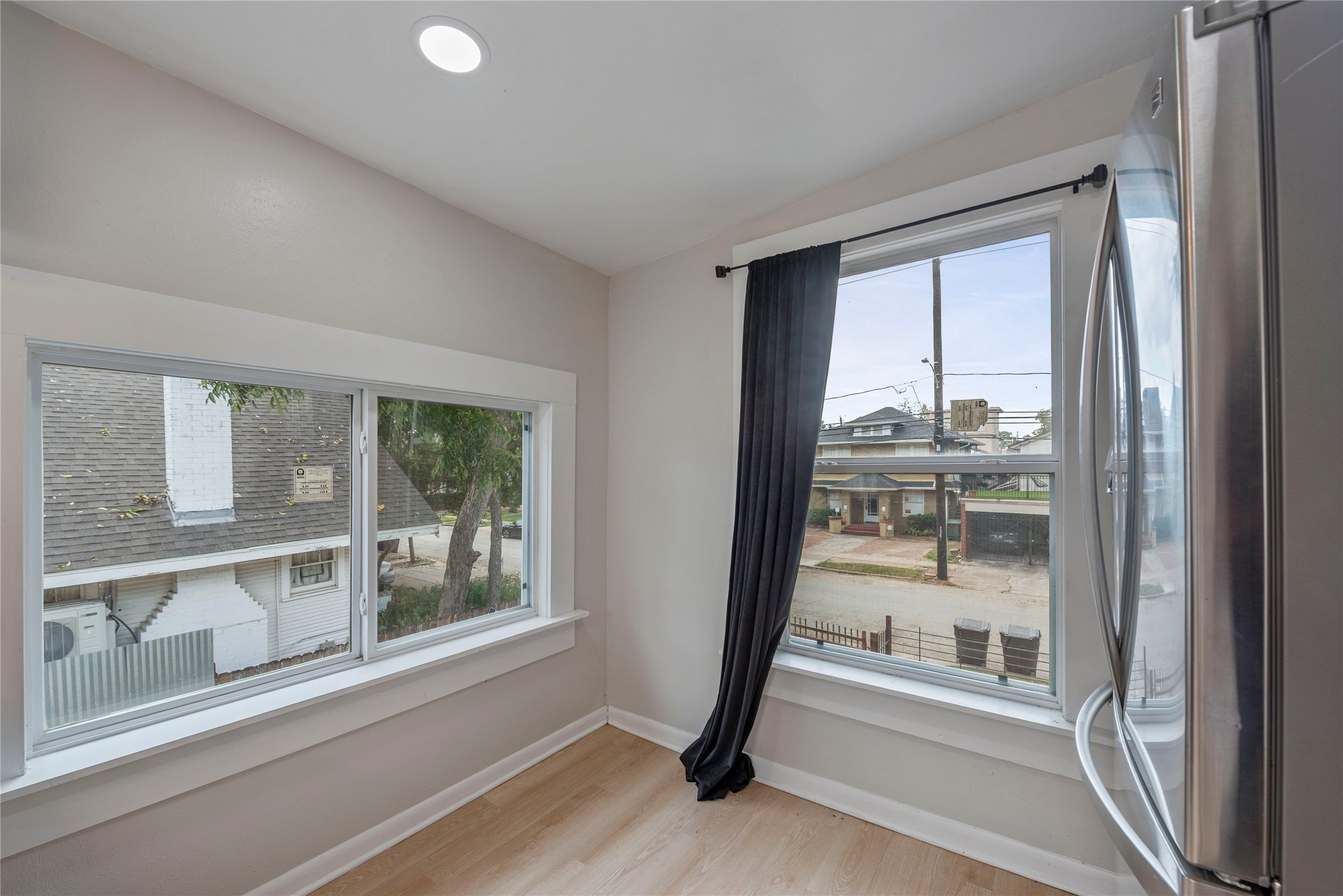 615 Pacific Street Houston, TX 77006 - Photo 11 of 30 a view of a room with a large window and wooden floor