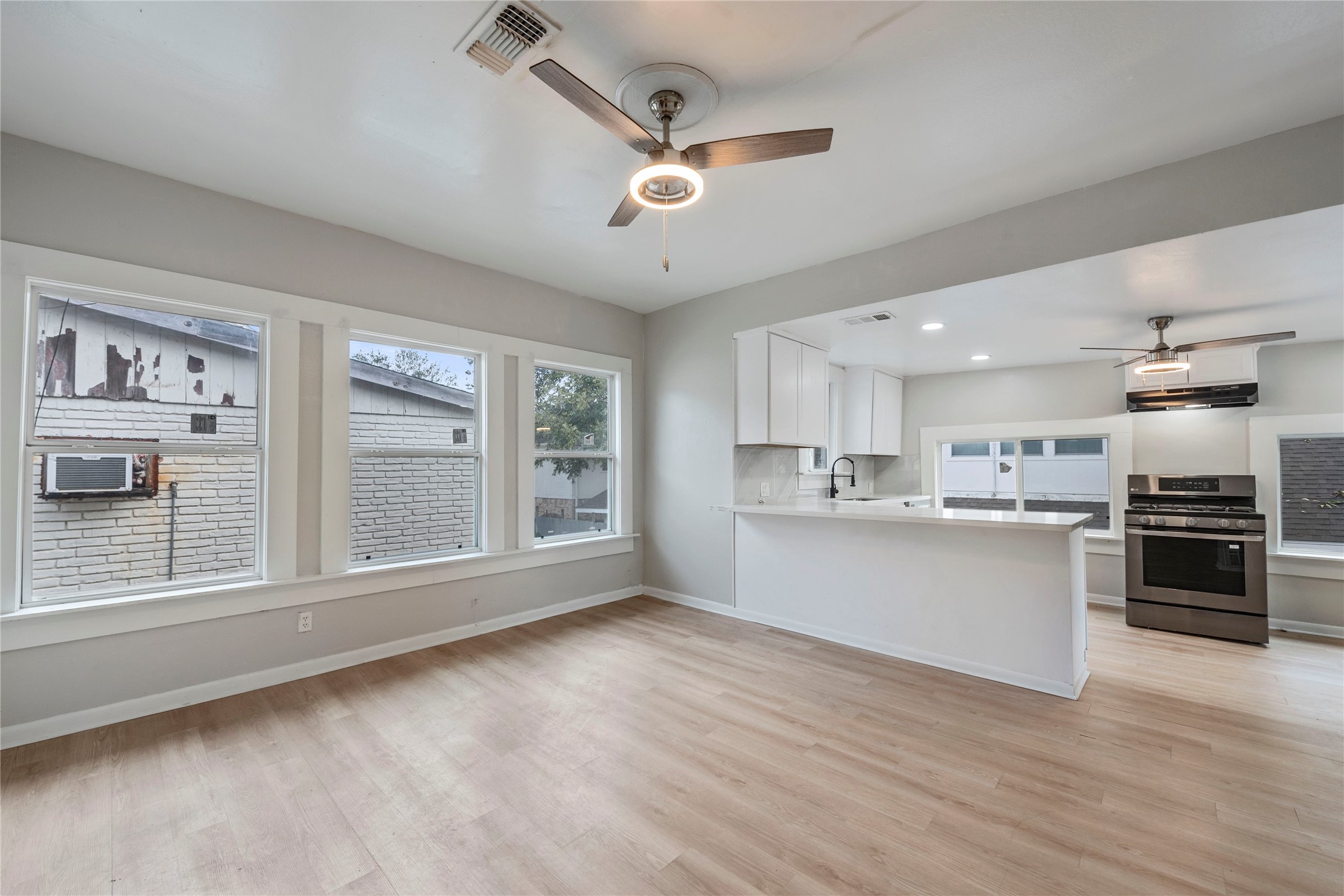 615 Pacific Street Houston, TX 77006 - Photo 6 of 30 a view of a kitchen with a sink cabinets and wooden floor