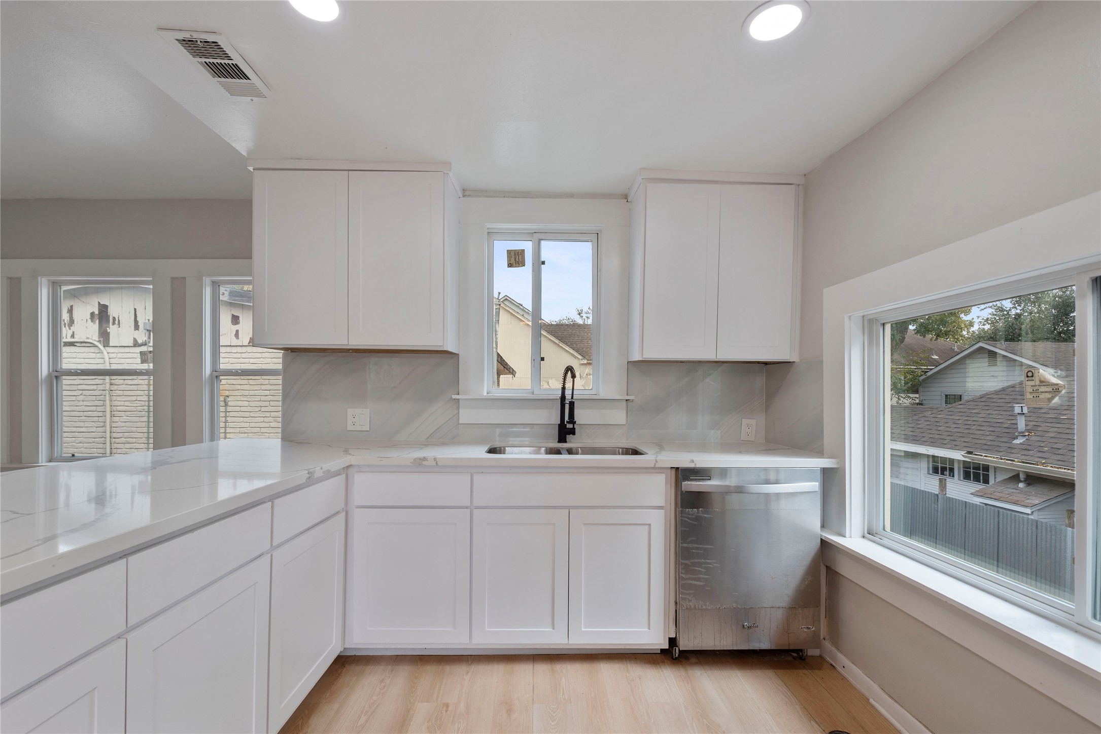 615 Pacific Street Houston, TX 77006 - Photo 9 of 30 a kitchen with a sink stove and cabinets