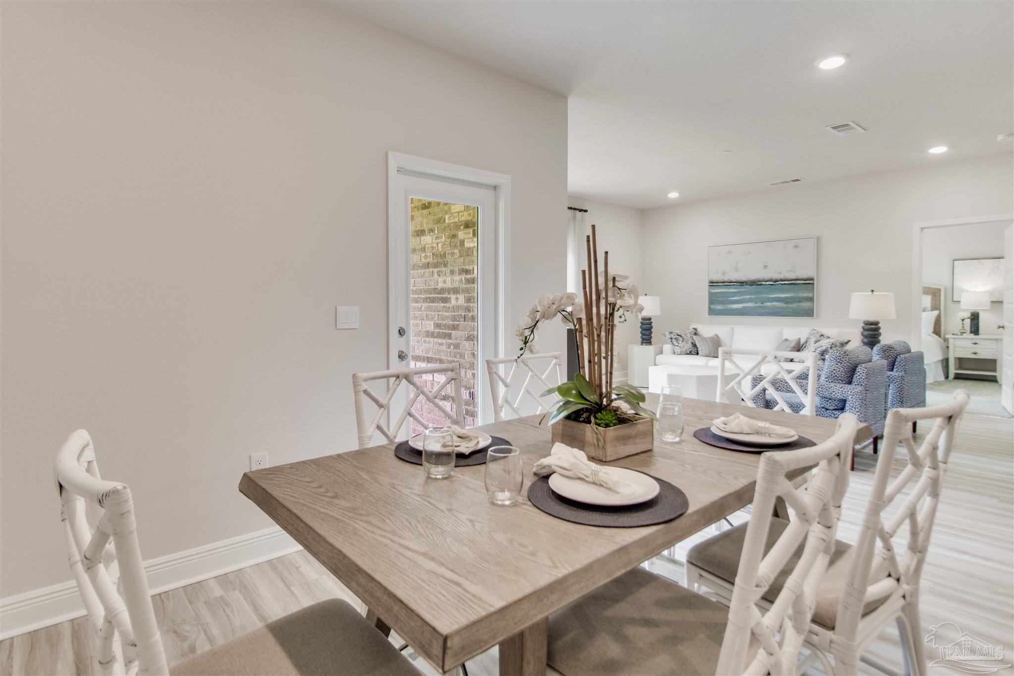 4745 Redhead Court Pace, FL 32571 - Photo 18 of 44 a view of a dining room with furniture