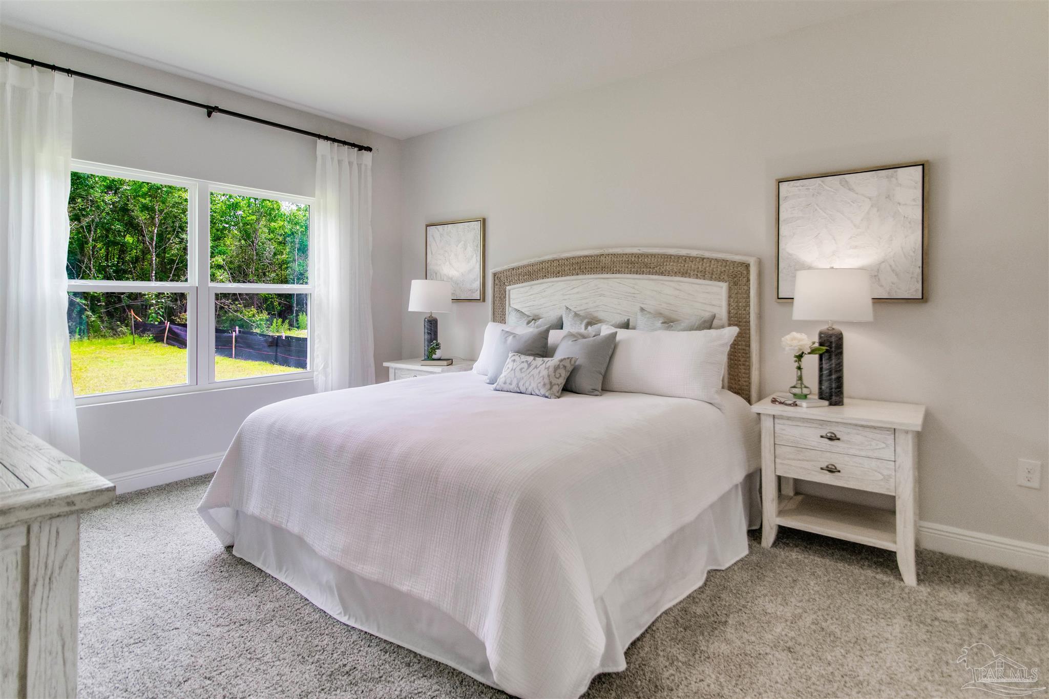 4745 Redhead Court Pace, FL 32571 - Photo 24 of 44 a bedroom with a bed and a large window